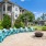 outdoor lounge area with modern seating and a firepit