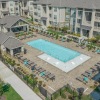 Swimming pool with lounge chairs at Pringle Square apartments in Charlotte, NC	