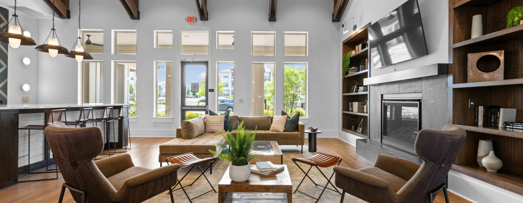 ounge room with seating and entertainment at Pringle Square upscale apartments in Charlotte
