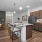 Open kitchen with island seating and stainless steel appliances