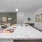 Granite island kitchen with view of living and dining areas.