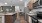 Kitchen with granite island, stainless steel appliances, and dining space