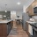 Kitchen with granite island, stainless steel appliances, and dining space