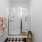 Bathroom with glass-enclosed walk-in shower.