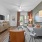 living area that includes area for a TV and bright lighting