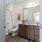 Bathroom featuring a tub, shower, and granite vanity